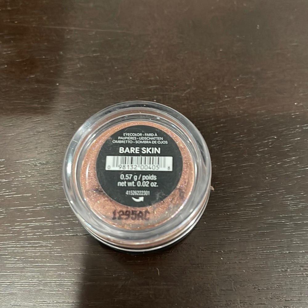 Bare Minerals Loose Eyeshadow color is “Bare Skin.”